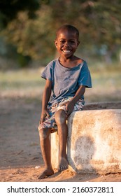 Mali,Kenya - Agust 13 2021:Happy Boy Without Shoes Waiting By The Roadside In Africa.
