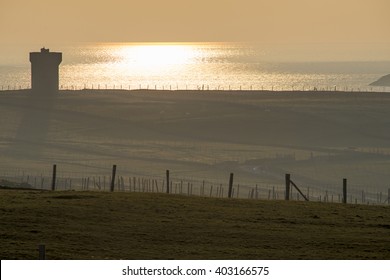 MALIN BEG, IRELAND - MARCH 17, 2016: Sunset Over Rathlin O'Birne Island Lighthouse.