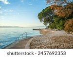 malinska, croatia, 29 april 2024,, sunset at the coast near abandoned hotel haludovo palace