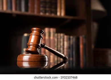 Mallet of the Judge on book background.