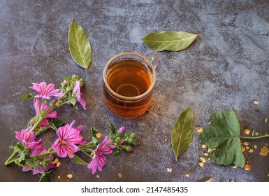 Mallow Herb And Mallow Flower Tea In Cup.