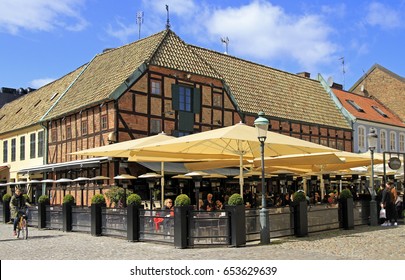 MALMO, SWEDEN - APRIL 22, 2017: People Are Eating In Cafe Located At Medieval House On The Market Place Lilla Torg In Malmo, Sweden