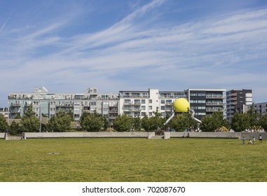 MALMO, SWEDEN - JULY 20, 2017: Modern Building In The West Harbor Of Malmo Sweden With A Playground In The Foreground.