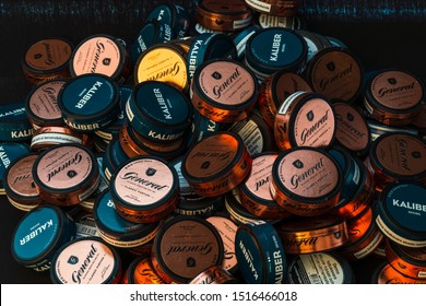 Malmo - Sweden September 27 2019: A pile of snuff cans In different brands and colours, Snus is addictive and very expensive