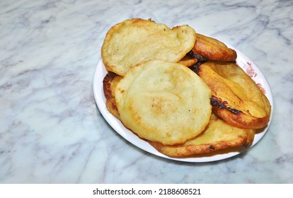 Malpua - A Bengali Traditional Dessert, Arranged On A White Ceramic Plate With Marbel Background