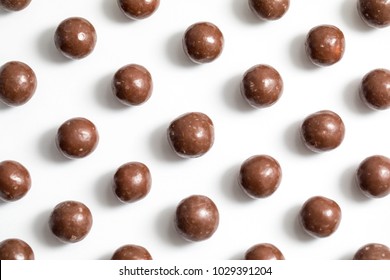 Malt Balls With Chocolate Shot Close Up On A White Background