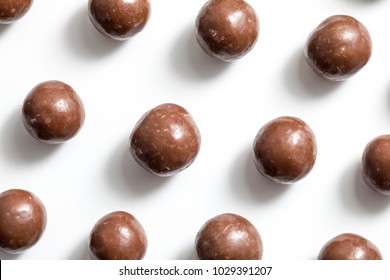 Malt Balls With Chocolate Shot Close Up On A White Background