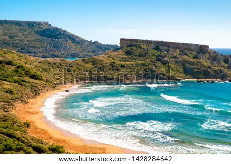 Malta beach. Beautiful sand beach. Ghajn tuffieha bay in summer. Tropical resort. Summer landscape with sea surf.