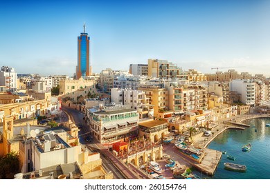 MALTA - JANUARY 20 2015: View to Portomaso tower over Spinola bay shore with famous touristic restaurants at St Julian, Malta
