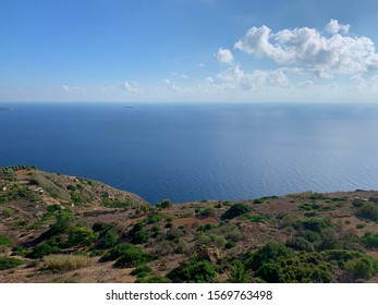 Malta, view from green and rocky Dingli Cliffs to the blue mediterranean sea. Mid autumn period