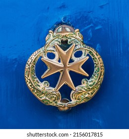 Maltese Star Door Knocker Seen On A Blue Wooden Door In Mdina, Malta In April 2022.