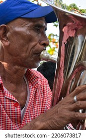 Maluku, Indonesia - September 24, 2022: A Man Playing A Bass Trumpet