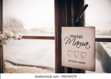 Mama Hotel Always Open - White Square Metal Plate With Text, Three Hearts Hanging On Wooden Window And White Orchid - Mother And Children Dependency Concept Photograph - Vintage Effect