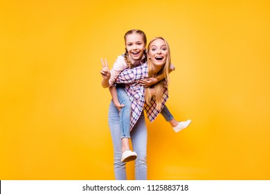 Mama Mom Older Siblings Game Parenthood Youth Concept. Portrait Of Dreamy Beautiful Mommy Holding Carrying Her Excited Cheerful Cute Sweet Lovely Girl On Back Isolated On Bright Vivid Background