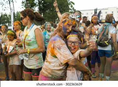 MAMAIA, ROMANIA - AUGUST 1, 2015. Happy  Unidentified People In The Night ,at The Color Run 2015.The Color Run Is A Worldwide Hosted Fun Which  Promote  Happiness By Bringing The Community Together .