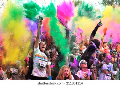 MAMAIA, ROMANIA - JULY 26: Crowds of unidentified people at The Color Run on July 26, 2014 in Mamaia, Romania. The Color Run is a worldwide hosted fun race with about 1500 competitors in Mamaia.