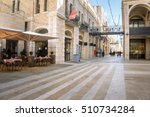 Mamilla road street near Jaffa gate of the old Jerusalem city, Israel. Urban landscape with open cafe tables and beautiful walking street at sunny day. Nice cozy street in the old town of Jerusalem