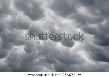 Mammatus clouds, cellular pattern of pouches hanging underneath the base of a thunderstorm cloud, also known as Cumulonimbus cloud, Baden-Wuettemberg, Germany, Europe