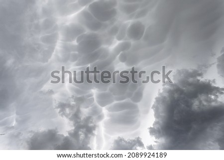 Mammatus storm clouds. Mammatus thunder clouds making an ideal stormy background.