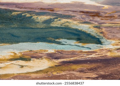 Mammoth Hot Springs in Yellowstone showcases vibrant terraces of mineral deposits, creating otherworldly geothermal formations. - Powered by Shutterstock