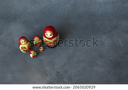 mamushka or matrioshka family looking up. with a gray background, the whole family of dolls together. Unit