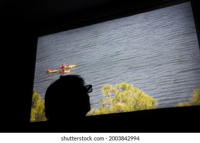 
Man With 3d Glasses Watching Movie On Mini Portable Cinema Projector At Home