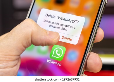 Man Is About To Delete The WhatsApp From A Smartphone, Close-up. Removing WhatsApp App. Protection Personal Data And Privacy. Russia, Moscow - March 7, 2021