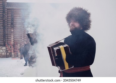 A Man With An Accordion In A Fur Hat At A Festive Performance. Kudykina Gora Park. Lipetsk Region. Russia. March 2021