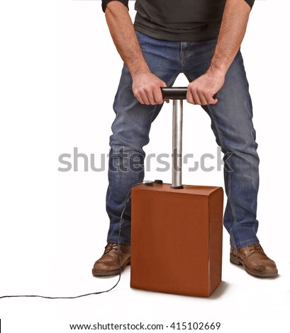 Man activating explosive detonator box.