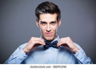 Man Adjusting Bow Tie
