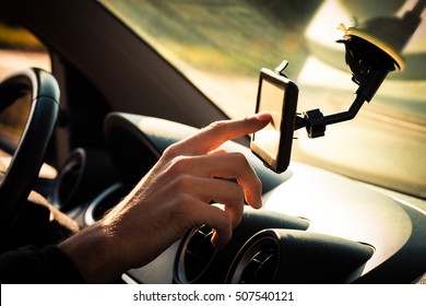 Man  Adjusting  Gps In Car Closeup