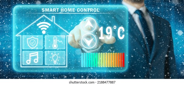 Man Adjusting Heating Temperature On A Virtual Screen Of Smart Home Controller, Winter Blizzard Background. Concept Of Forced Thrift Because Increased Price For Heating Home.