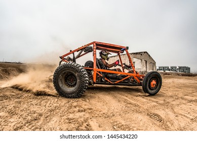 A man with a lot of adrenaline driving a buggy on a dune that falls after a jump. - Powered by Shutterstock