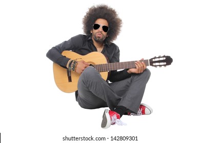 Man With An Afro Posing With A Guitar