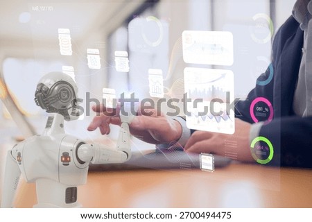 Man and AI humanoid robot using laptop work together and collaborating AI agent work with AI Financial management technology.Advisor using KPI Dashboard on virtual screen working with robot