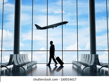 Man In Airport And Airplane In Sky