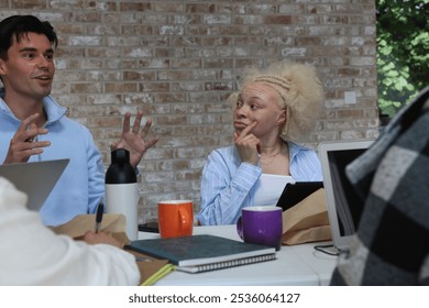 Man and albino woman during business meeting - Powered by Shutterstock