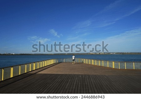                    Man alone looking the river in Ayamonte            