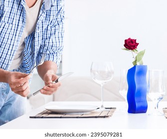 Man alone preparing for romantic date with his sweetheart