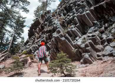 Man amazed by the Devil's Postpile, Eastern Sierra Nevada, California, USA 