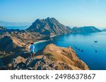 Man with amazing view of Padar island at Padar island in Komodo National Park, Indonesia. summer background and summer holiday concept. 