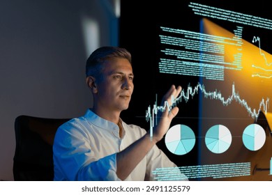 Man Analyzing Data On Virtual Screen In Office, Focused On Interactive Graphs And Charts To Make Informed Decisions, Concept Of Technology And Innovation In Business