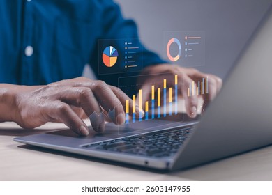 Man analyzing data working on computer , concept of business data analysis using statistical graphs, data management structure work on dashboard, evaluate and measure business performance.