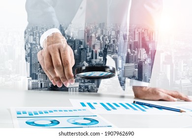 Man Analyzing Financial Documents With Magnifying Glass. Financial Expertise And Consulting. Manager In Suit Working With Business Analytics. Entrepreneurship And Leadership Double Exposure Concept