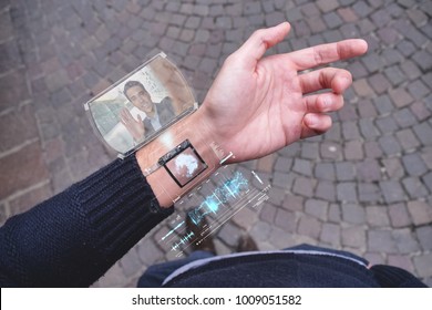 A man answers the friend who smiles and waves from the phone that appears in hologram clock futuristic and technological. Concept: holiday, communication, technology, augmented reality and future - Powered by Shutterstock