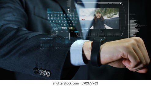 A man answers the wife who smiles and waves from the phone that appears in hologram clock futuristic and technological. Concept: holiday, communication,family, technology, augmented reality and future