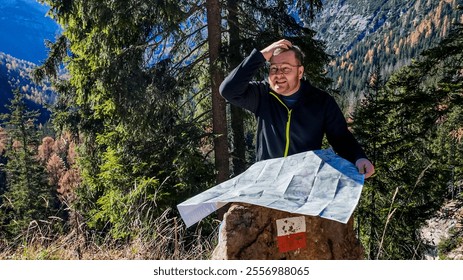 A man appearing lost while reading a map in a mountainous forest, illustrating travel challenges and adventure Dolomite Alps