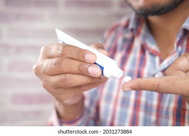 Man Applying Antibiotic Cream Close Up