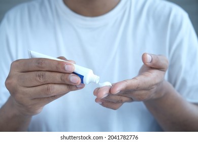 Man Applying Antibiotic Cream Close Up