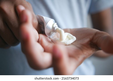 Man Applying Antibiotic Cream Close Up